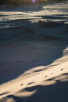 Shadowed sand dunes with abstract patterns 