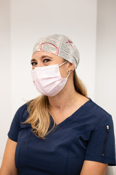 Confident health worker in mask showing resilience in uniform