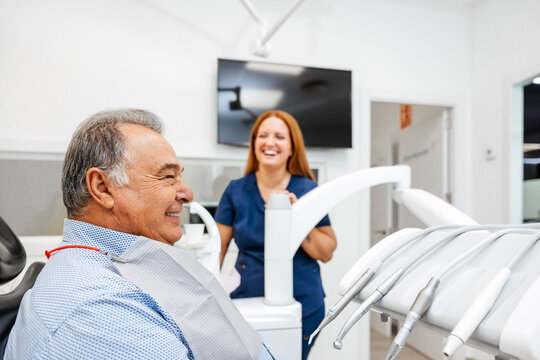 Dental Checkup With Smiling Dentist and Satisfied Patient