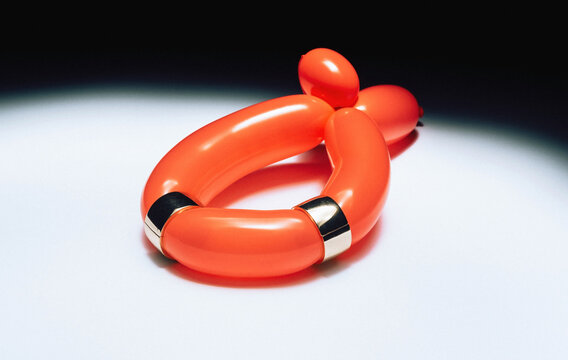 Red balloon with earrings.