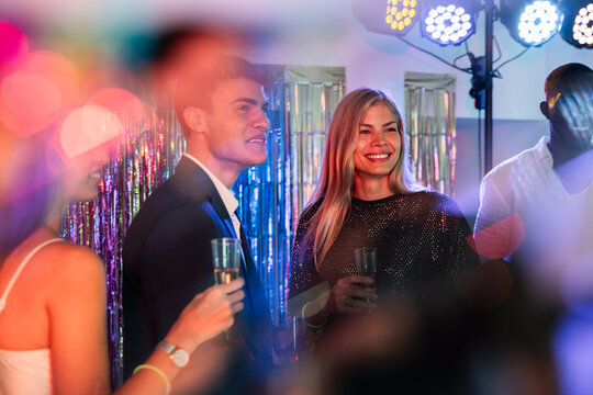 Festive gathering with friends enjoying a colorful party night