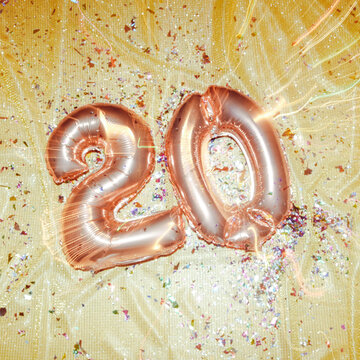 pink balloons forming number 20, motion blur