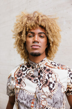 Vibrant Expression: Stylish gay man in Patterned Shirt with Pier