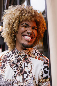 A Joyful Portrait of Gay Man Laughing with Bold Hairstyles