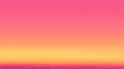 Beautiful sunset showcasing vibrant pink and orange hues over a serene landscape during twilight
