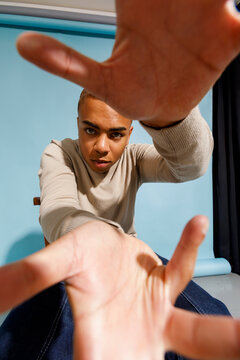 man interacting playfully with camera 