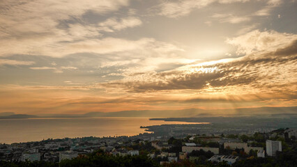 Orange sunset over Lake Geneva and the Swiss Jura