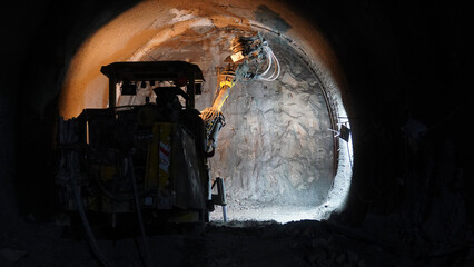 construction equipment drills borehole in subway tunnel construction