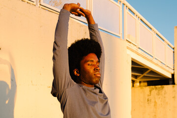 Diverse man practices deep breathing during a mindfulness session