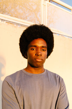 Portrait of a thoughtful young sporty man looking confident at camera