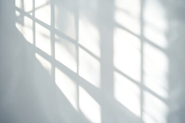 Fototapeta premium A shadow of a window on a wall, great for abstract or minimalist backgrounds