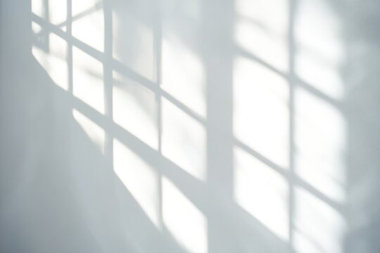 A shadow of a window on a wall, great for abstract or minimalist backgrounds
