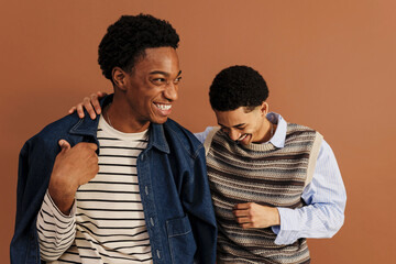 Two friends laughing together, sharing a moment of joy