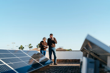 Homeowners inspecting their solar panels