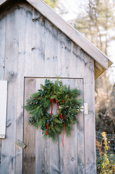 christmas wreath on barn door