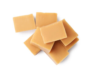 Tasty sweet caramel candies isolated on white, top view