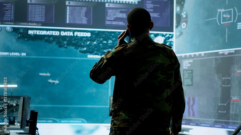 Poster military man answers phone call in a mission control center, working with advanced technology and sa