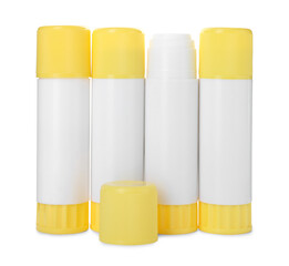 Many different glue sticks isolated on white