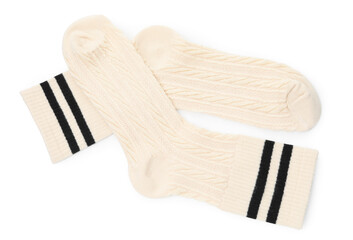 Pair of soft socks isolated on white, top view