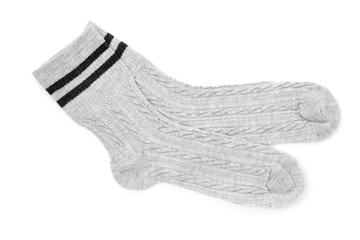 Pair of soft socks isolated on white, top view