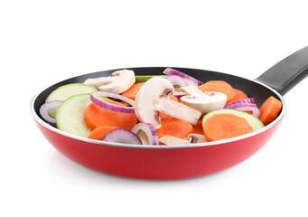 Frying pan with mix of fresh vegetables and mushrooms isolated on white