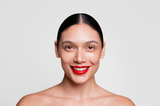 Smiling Woman with Bold Red Lips and Radiant Skin