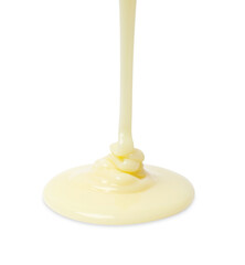 Pouring delicious condensed milk isolated on white