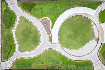 Aerial View of a Building's Atrium with Green Spaces and Paths