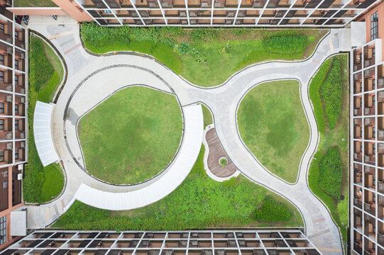 Aerial View of Modern Courtyard with Pathways and Green Spaces