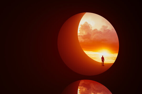 Silhouette of a man in a round window under a colorful sunset