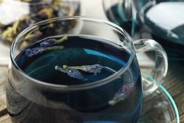 Delicious butterfly pea flower tea on table, closeup