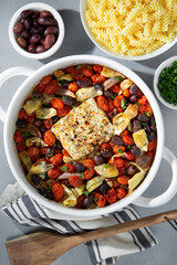 TikTok Baked Feta Pasta with roasted tomatoes, olives, feta cheese, herbs, artichoke hearts and rotini pasta