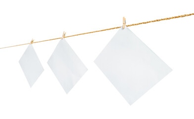 blank papers hanging on clothesline