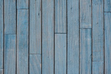 Vintage blue wood planks board with abstract pattern .Blue textured shabby wooden wall background with grains structures and scratches