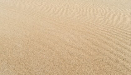 Background of beige beach sand with natural pattern, top wiev 