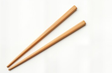 Pair of light brown wooden chopsticks isolated on pure white background. Simple design. Classic Asian utensil. Perfect for dining. Ideal for Asian food culture. Suitable for food bloggers online food