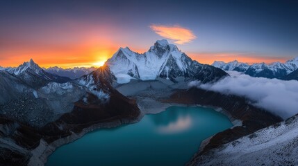 Obraz premium Majestic mountain landscape at sunset with a tranquil lake.