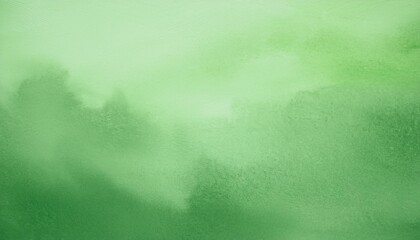 Abstract green watercolor wash background. Soft, dreamy texture.