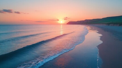 Obraz premium Sunset Ocean Waves Crashing on Sandy Beach near Cliffs