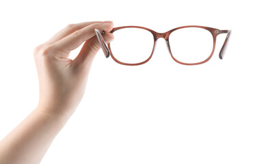 Woman holding glasses with brown frame on white background, closeup
