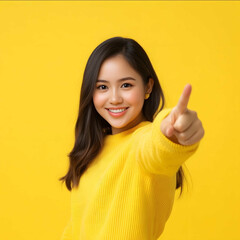 a filipina virtual assistant wearing yellow sweater clothes pointing at the camera energetic yellow background