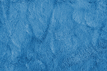 Soft shaggy blue carpet texture. Fluffy synthetic textile fur, plush textile, blanket cloth...
