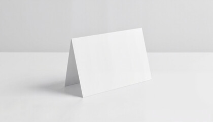 Minimalist folded card mockup on clean tabletop in bright daylight, design concept