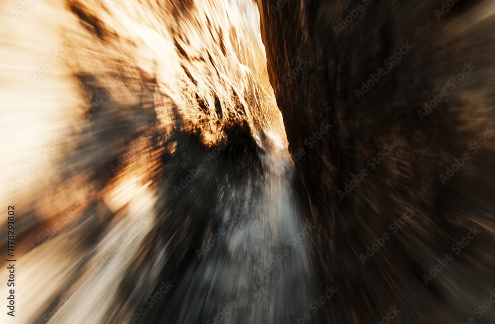 Poster abstract motion blur image of a narrow canyon with warm light.