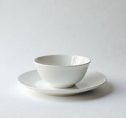 Fototapeta premium White bowl on a white plate on a white surface