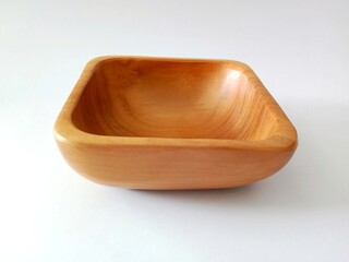 empty wooden bowl on a white background 