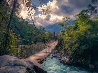 Rustic rope bridge spanning a vibrant river in a lush, mountainous jungle.