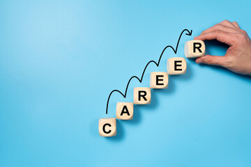 Career progression, illustrated with wooden blocks forming the word CAREER, arranged in ascending...