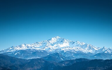 Obraz premium Breathtaking snowy mountain range with a clear blue sky, symbolizing resilience, challenges, and the thrill of travel and adventure, serene vacation atmosphere, highquality image
