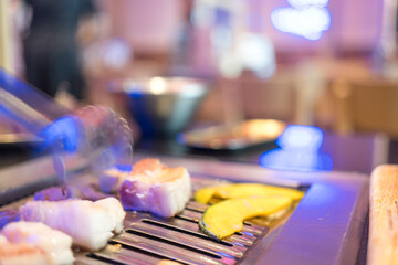 Grilled pork belly slices in traditional Korean culinary style. Close up